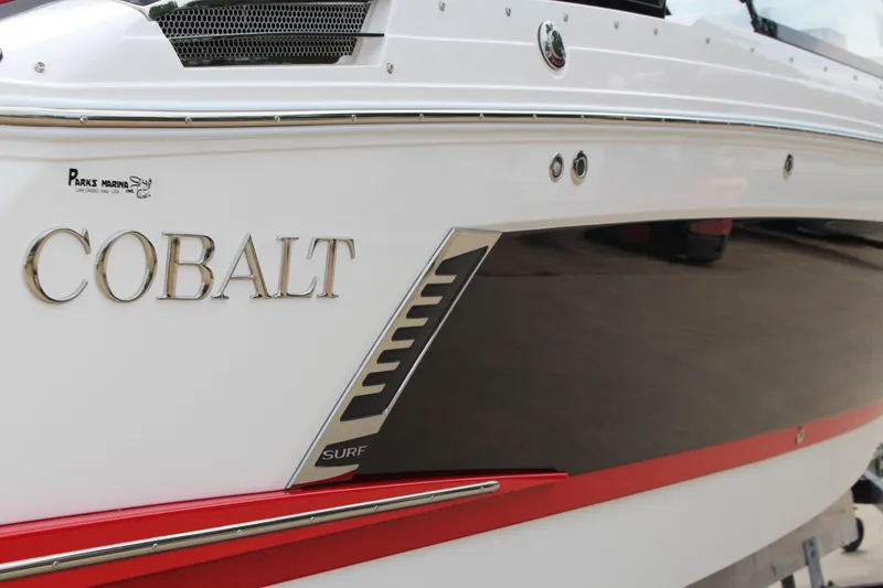 Slide: The Image of 2024 Cobalt R4 Surf boat with sleek design and red accent. - 43