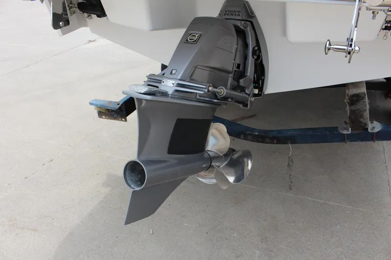 Slide: The Image of 2024 Cobalt R4 Surf boat with Volvo Penta outdrive on trailer. - 5