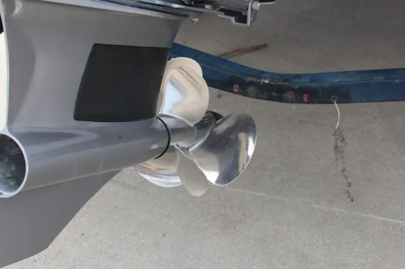 Slide: The Image of 2024 Cobalt R4 Surf boat propeller close-up on concrete surface. - 6