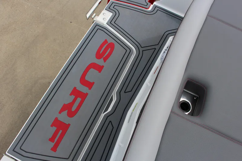 Slide: The Image of 2024 Cobalt R4 Surf boat deck with "Surf" logo in red. - 7