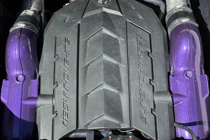 Slide: The Image of Supercharged engine of 2025 MasterCraft XStar 23 with purple components. - 17
