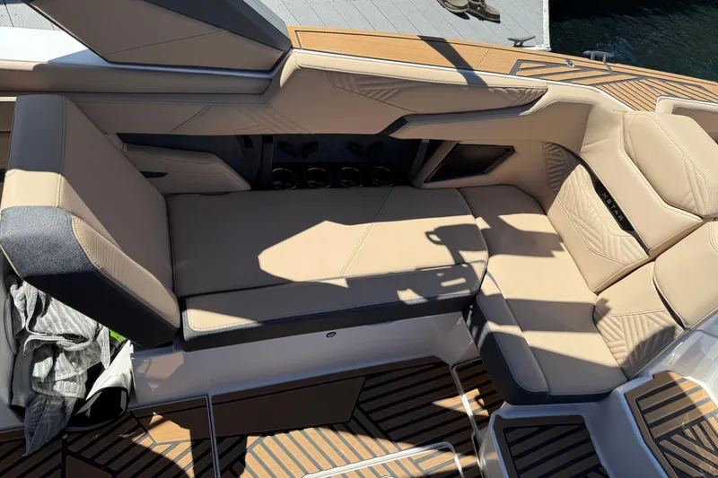 Slide: The Image of Luxurious seating on 2025 MasterCraft XStar 23 boat with tan upholstery and sleek design. - 8