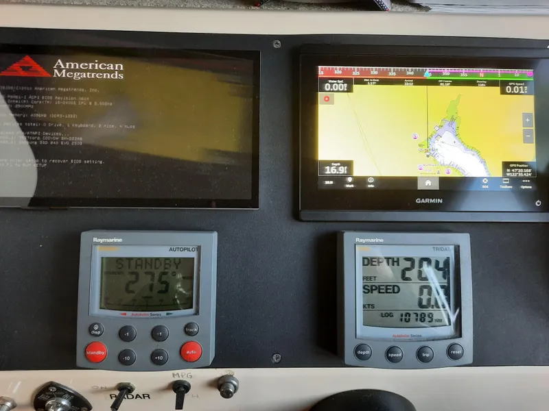 Slide: The Image of Boat dashboard with navigation and autopilot displays, Camano Troll 2004 model. - 17