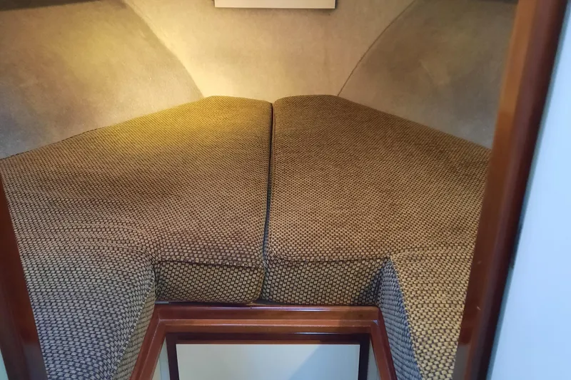 Slide: The Image of 2004 Camano Troll boat interior with cozy V-berth sleeping area. - 25