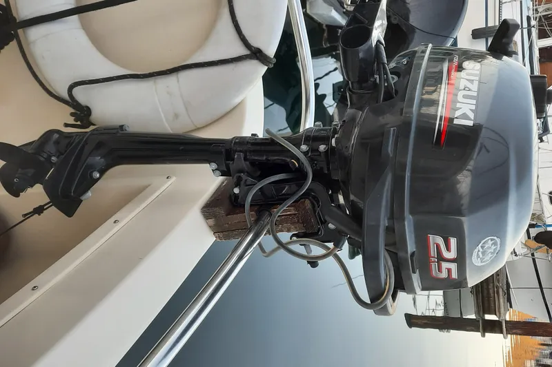 Slide: The Image of Suzuki 25 horsepower outboard motor on a 2004 Camano Troll boat. - 34