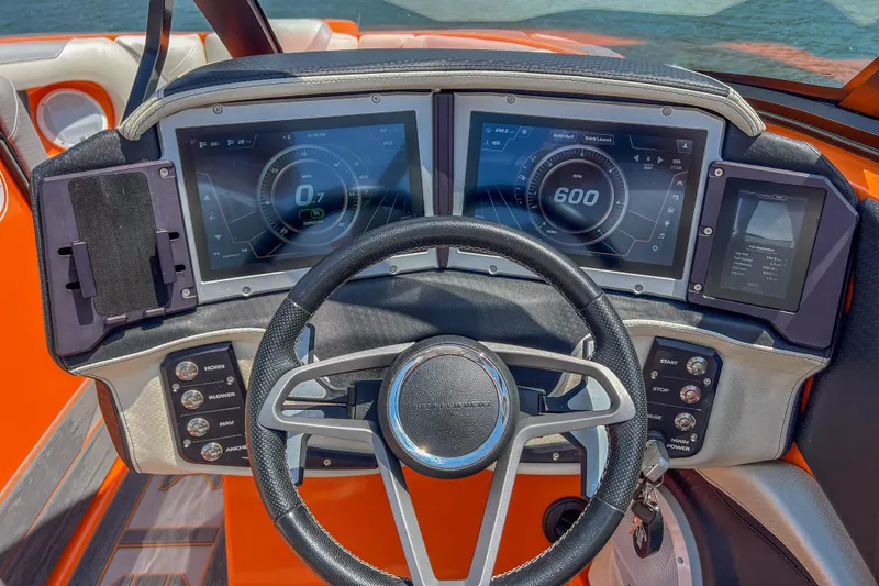 Slide: The Image of Dashboard of a 2022 Centurion Ri245 boat with digital displays and controls. - 30