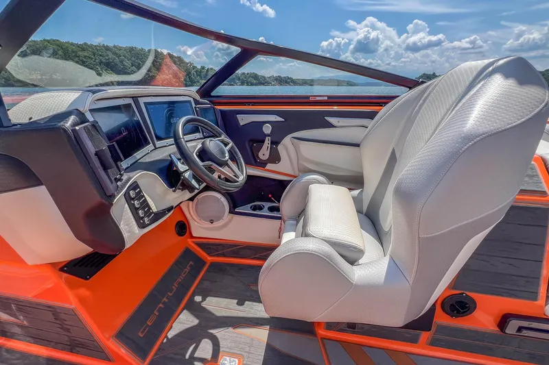 Slide: The Image of 2022 Centurion Ri245 boat interior with modern dashboard and comfortable seating. - 32