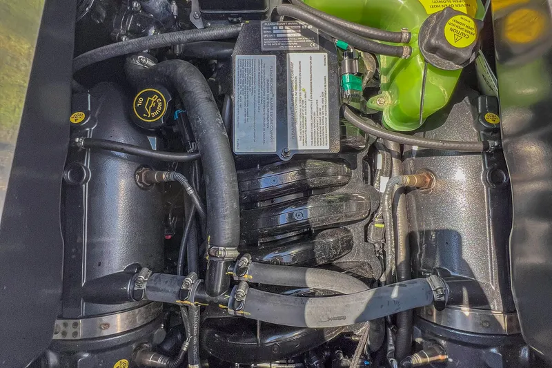 Slide: The Image of Engine compartment of 2022 Centurion Ri245 boat, showing detailed components and hoses. - 36