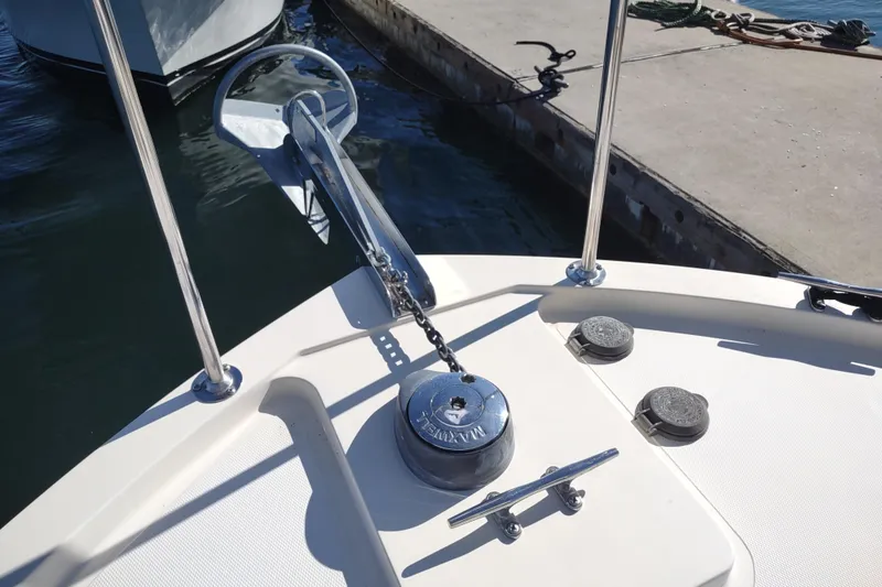 Slide: The Image of Bow of 2000 Camano Troll boat with anchor and winch system. - 16