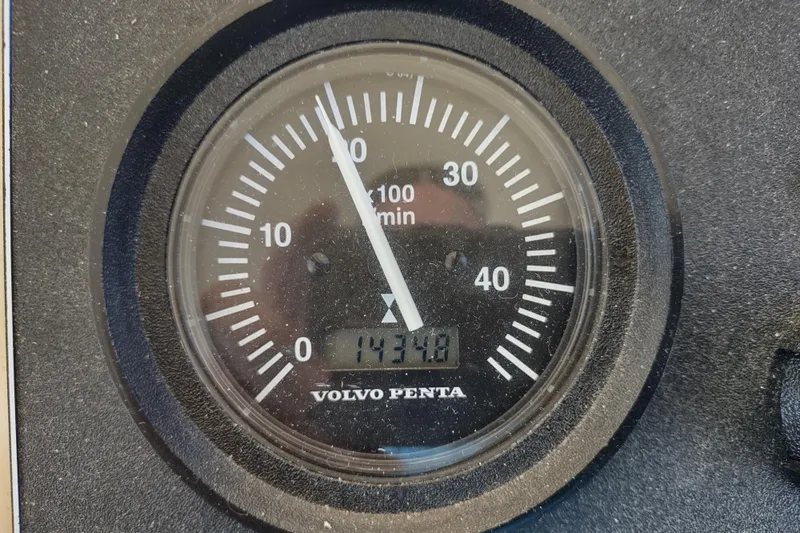 Slide: The Image of Volvo Penta tachometer on 2000 Camano Troll boat, displaying 1430 RPM. - 30