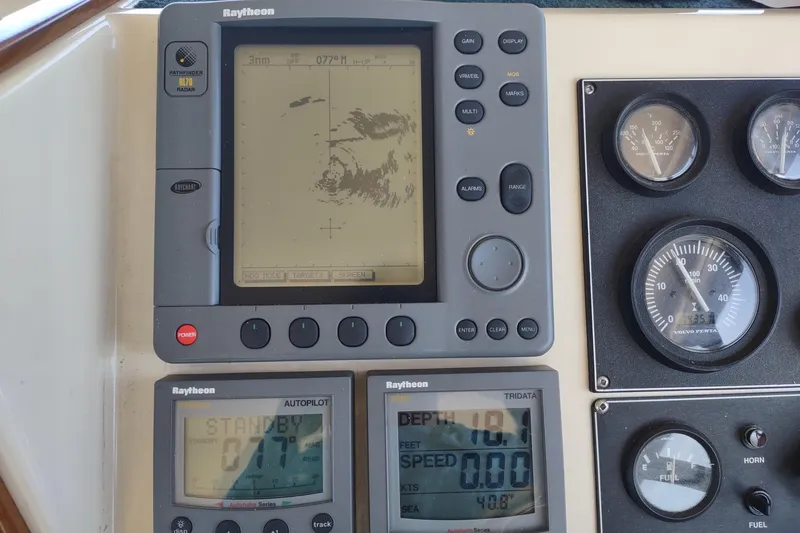 Slide: The Image of Boat dashboard with Raytheon navigation equipment on a 2000 Camano Troll. - 31
