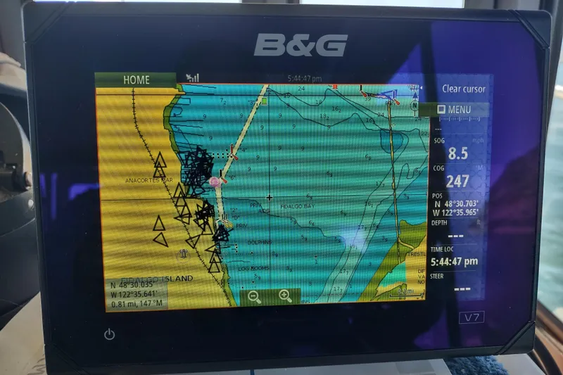 Slide: The Image of Navigation display on a 2000 Camano Troll boat showing marine chart and coordinates. - 33