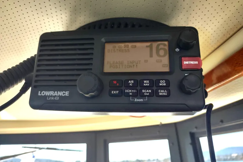 Slide: The Image of Lowrance Link-8 marine radio on 2000 Camano Troll boat, displaying distress signal. - 34