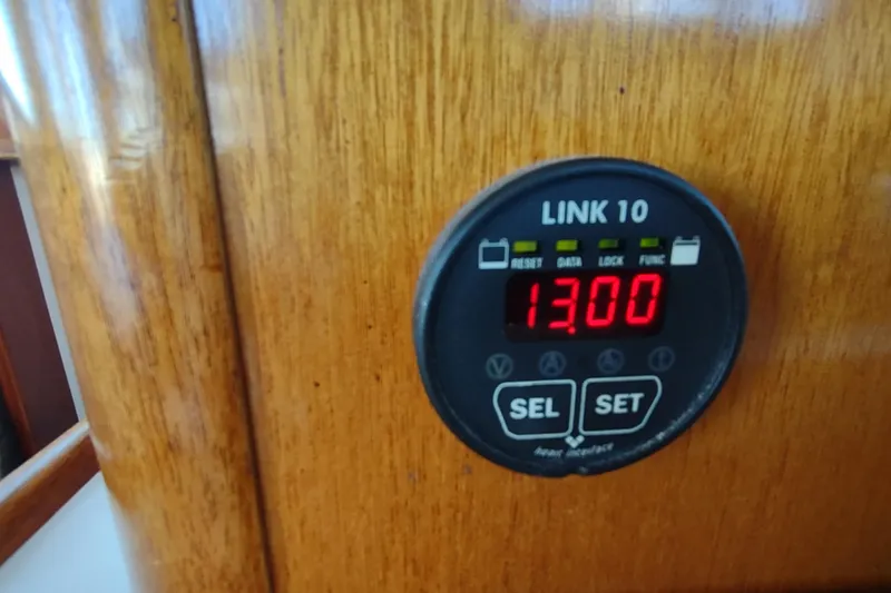Slide: The Image of Digital display on 2000 Camano Troll boat, showing "13.00" on wooden panel. - 44