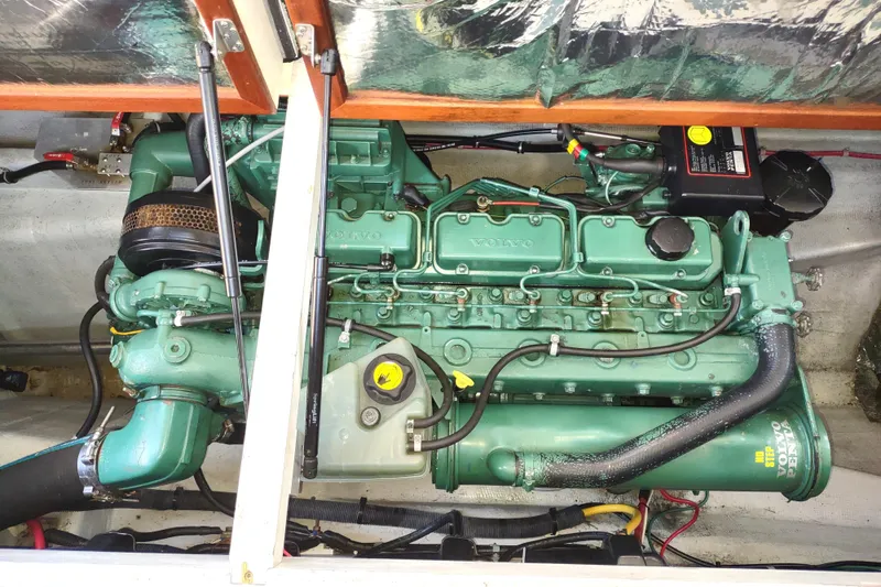 Slide: The Image of Engine compartment of a 2000 Camano Troll boat with a Volvo Penta engine. - 49