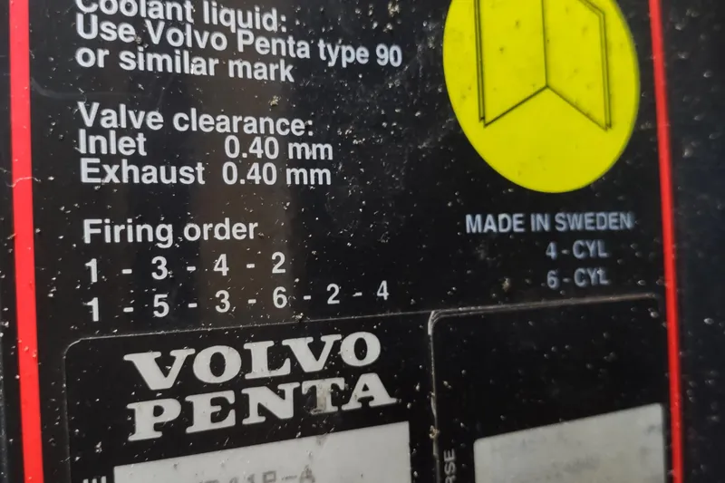 Slide: The Image of Label on Volvo Penta engine detailing valve clearance and firing order, Camano Troll 2000. - 50