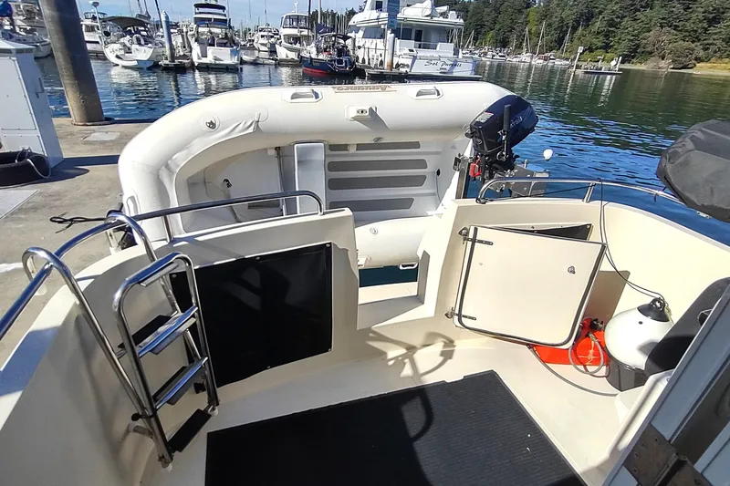 Slide: The Image of 2000 Camano Troll boat interior with ladder, docked at marina. - 8
