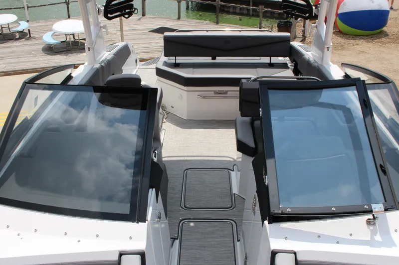 Slide: The Image of 2024 Cobalt R6 Surf boat interior with sleek seating and modern design. - 11