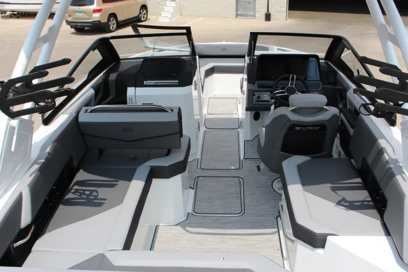 Slide: The Image of 2024 Cobalt R6 Surf boat interior with sleek seating and modern dashboard design. - 13