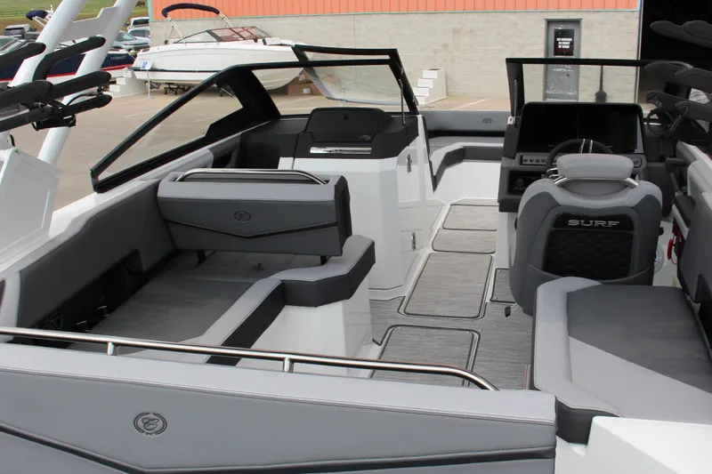 Slide: The Image of 2024 Cobalt R6 Surf boat interior with sleek seating and modern dashboard design. - 4