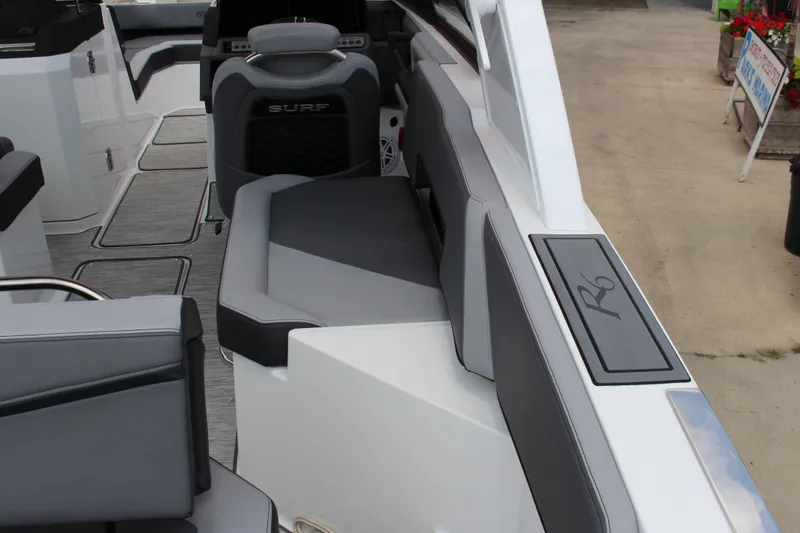 Slide: The Image of 2024 Cobalt R6 Surf boat interior with sleek seating and modern design. - 5