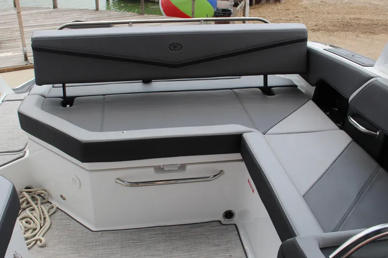 Slide: The Image of 2024 Cobalt R6 Surf boat interior with sleek gray seating and modern design. - 6