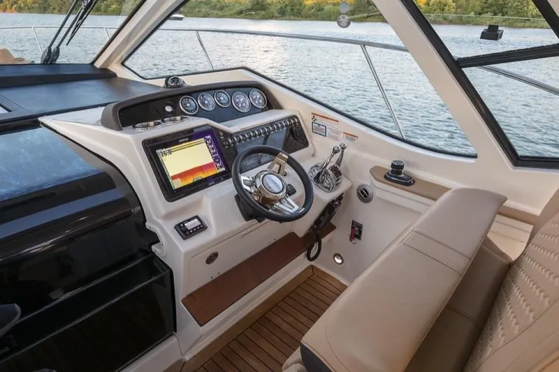 Slide: The Image of Manufacturer Provided Image: 2019 Sea Ray Sundancer 350 Coupe helm with modern navigation system and leather seating. - 20