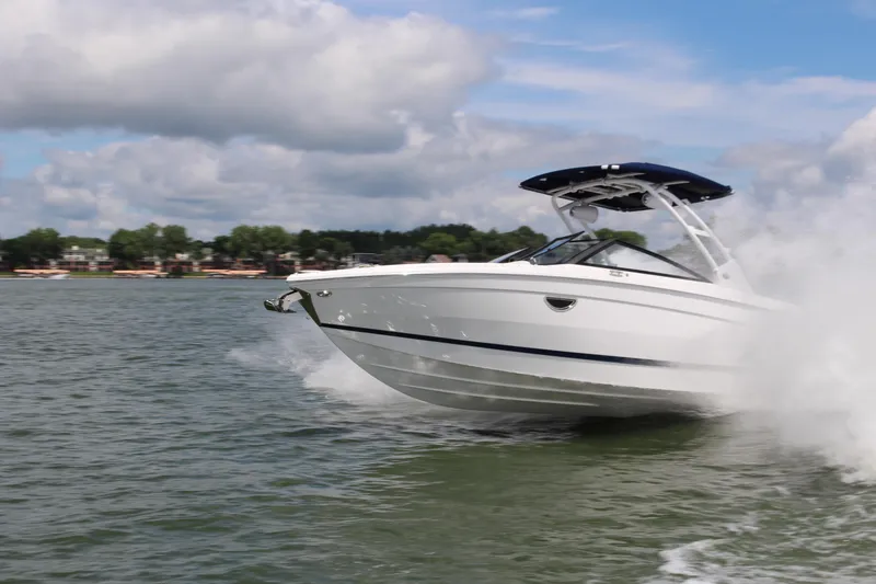 Slide: The Image of 2024 Cobalt R8 Outboard speeding on a lake under a cloudy sky. - 3