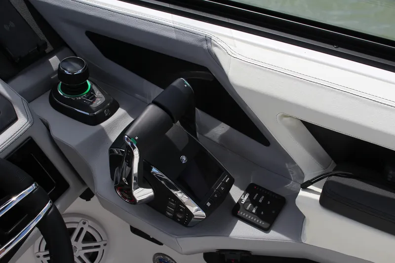 Slide: The Image of 2024 Cobalt R8 Outboard boat controls with joystick and throttle. - 5