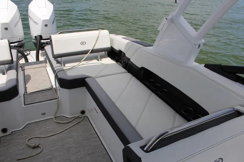 Slide: The Image of 2024 Cobalt R8 Outboard boat interior with seating and twin Mercury engines. - 9