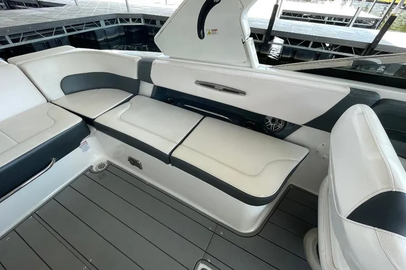 Slide: The Image of 2020 Chaparral 297 SSX boat interior with sleek seating and modern design. - 11
