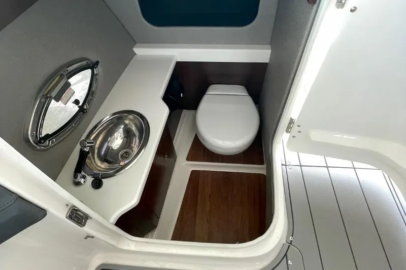 Slide: The Image of 2020 Chaparral 297 SSX boat interior with luxurious seating and water view. - 6