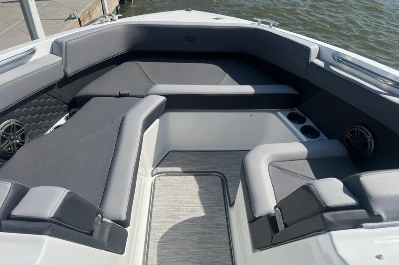 Slide: The Image of 2024 Cobalt R6 Surf boat interior with sleek seating and cup holders. - 4