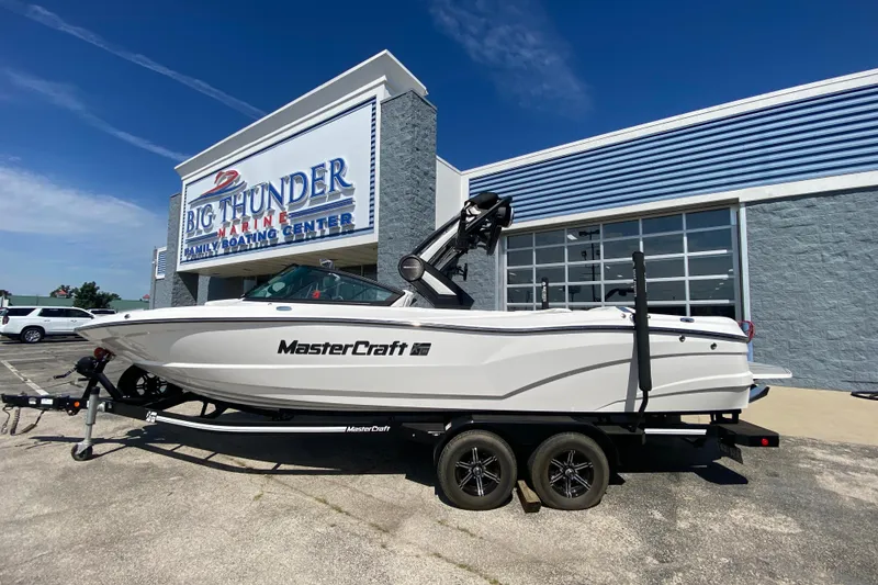 The Image of 2022 MasterCraft XT25 boat on trailer at Big Thunder Marine center. - 1