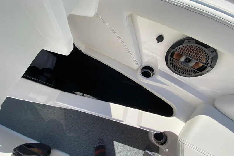 Slide: The Image of Interior of 2022 MasterCraft XT25 boat showing speaker and storage compartment. - 36
