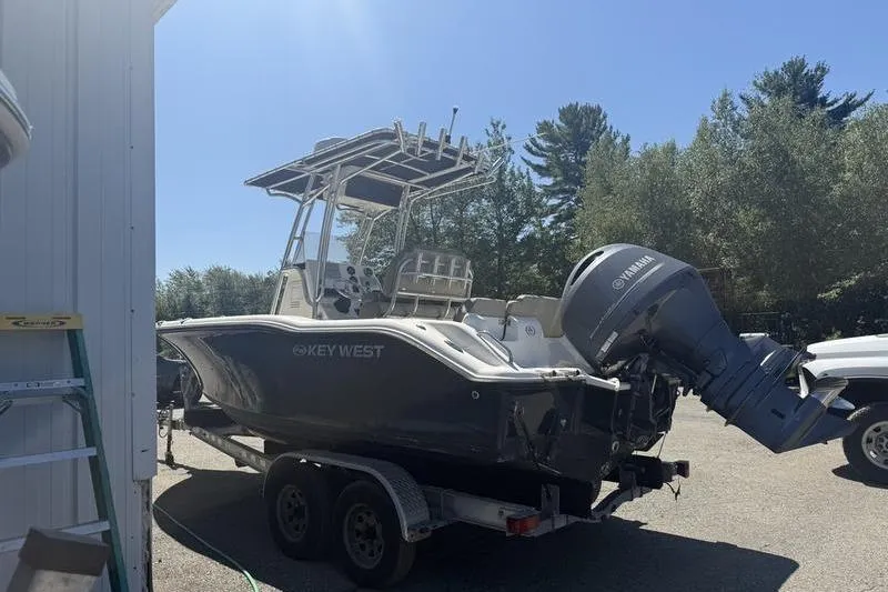 Slide: The Image of 2021 Key West 219 FS boat on trailer with Yamaha outboard motor. - 10