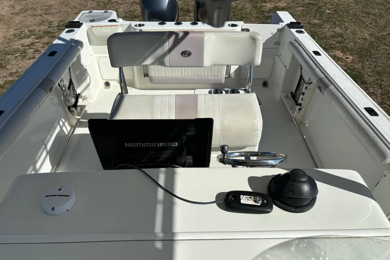 Slide: The Image of 2006 Sailfish 2660 CC boat interior with Humminbird electronics and seating. - 11