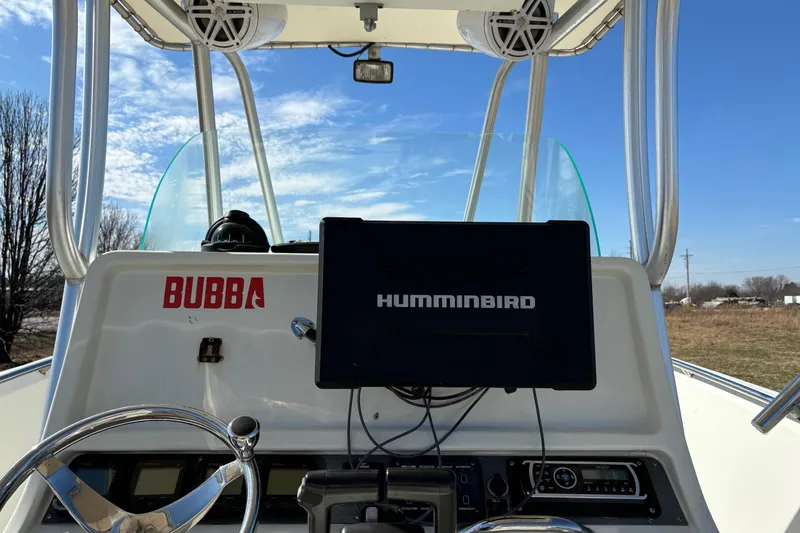 Slide: The Image of 2006 Sailfish 2660 CC boat console with Humminbird display and Bubba sticker. - 12