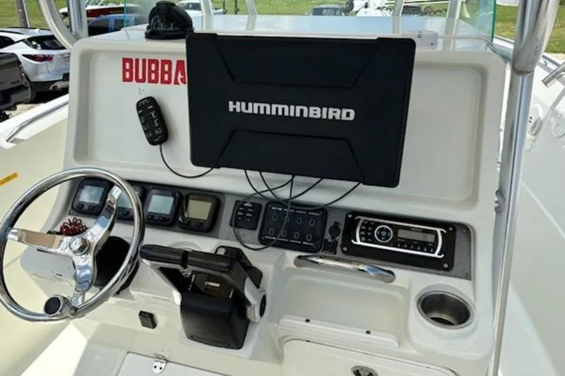 Slide: The Image of Minn Kota Riptide motor on 2006 Sailfish 2660 CC boat, outdoor setting. - 5