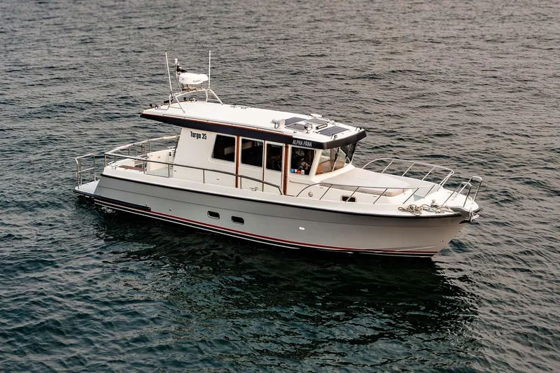 Slide: The Image of 2019 Targa 35 boat cruising on open water, showcasing sleek design and modern features. - 1