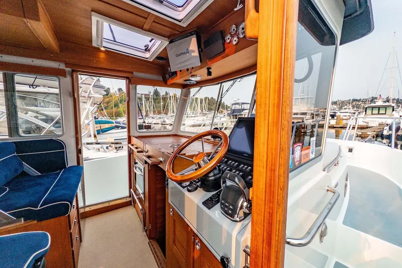Slide: The Image of Interior of 2019 Targa 35 boat with wooden helm and modern navigation equipment. - 17