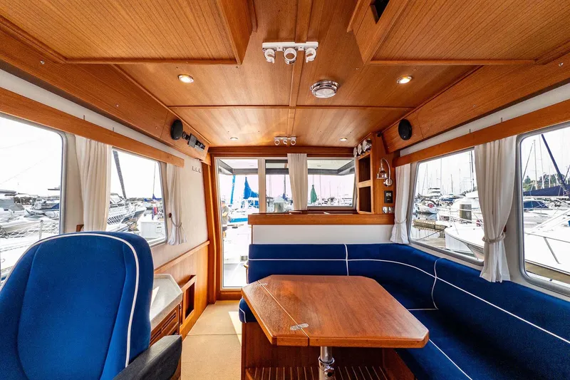 Slide: The Image of Interior of 2019 Targa 35 boat with wooden finish and blue seating. - 24