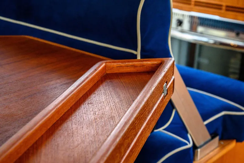 Slide: The Image of Luxurious wooden interior detail of a 2019 Targa 35 boat with blue upholstery. - 27