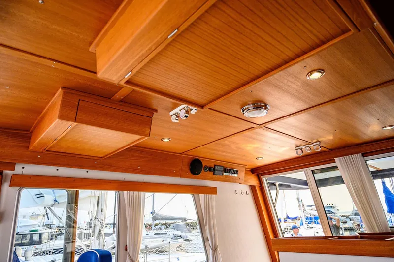 Slide: The Image of Interior of 2019 Targa 35 boat with wooden ceiling and modern lighting. - 30