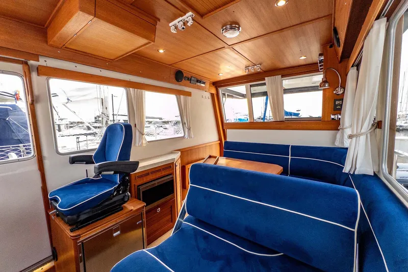 Slide: The Image of Luxurious 2019 Targa 35 yacht interior with blue seating and wooden accents. - 35