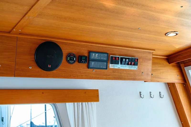 Slide: The Image of Wooden interior of 2019 Targa 35 boat with control panel and speaker. - 38