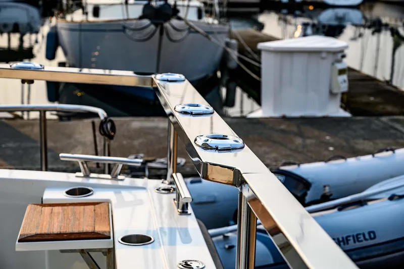 Slide: The Image of Polished railing on a 2019 Targa 35 boat docked at a marina. - 46