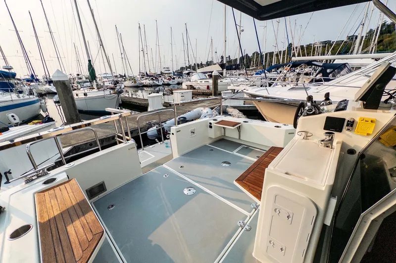 Slide: The Image of 2019 Targa 35 boat docked at marina, surrounded by sailboats and yachts. - 51