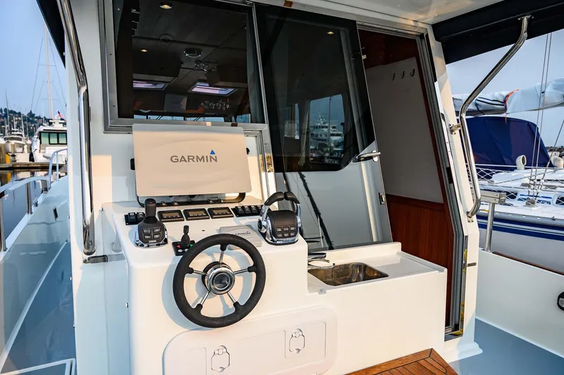 Slide: The Image of 2019 Targa 35 boat helm with Garmin navigation system and modern controls. - 53