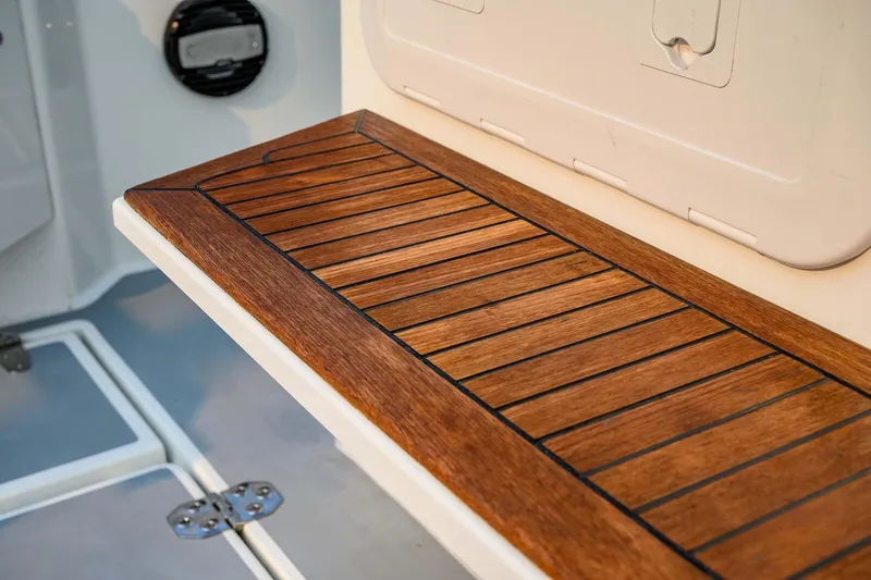 Slide: The Image of Wooden deck detail on 2019 Targa 35 boat, showcasing elegant craftsmanship. - 55